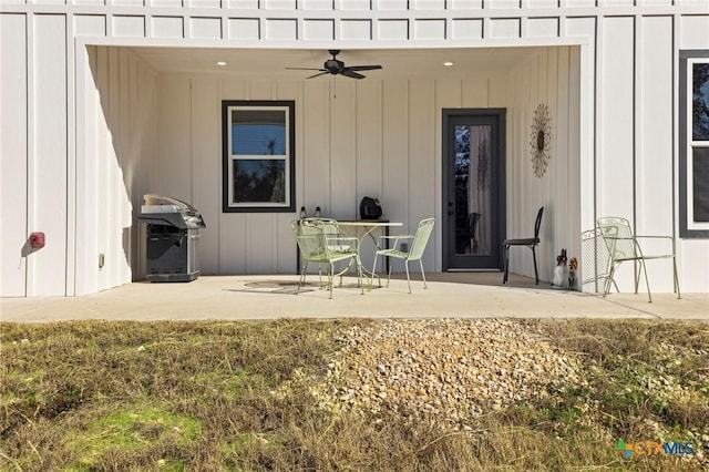 view of exterior entry with ceiling fan