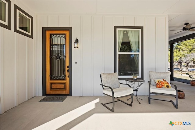 view of exterior entry featuring ceiling fan