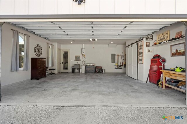 garage with electric panel and sink