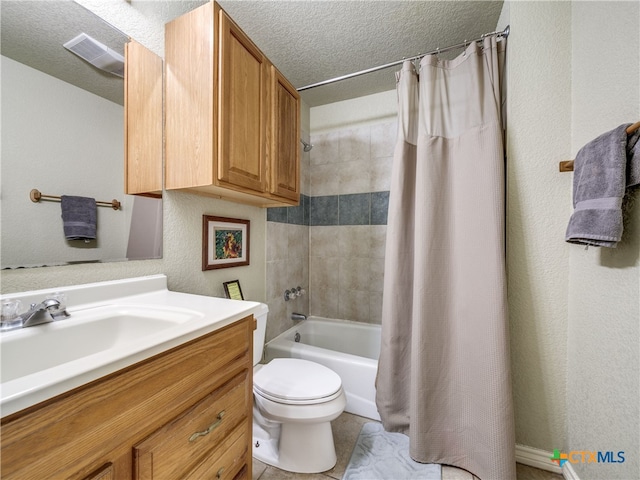 full bathroom with toilet, shower / tub combo, a textured ceiling, vanity, and tile patterned flooring