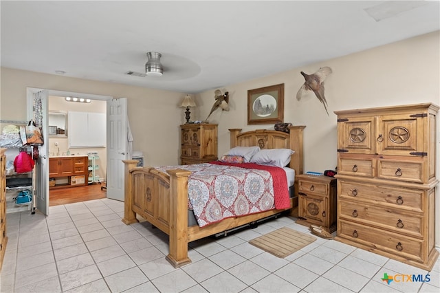 bedroom featuring light tile patterned flooring and ceiling fan