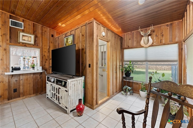 tiled living room with wood walls and wooden ceiling