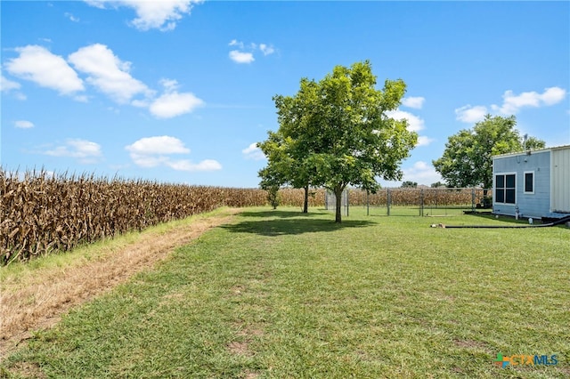 view of yard with a rural view