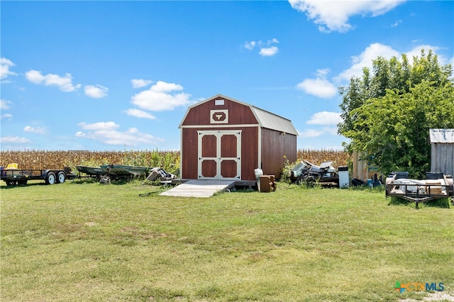 view of outbuilding featuring a yard