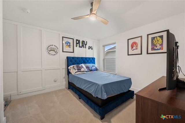 bedroom with light carpet and ceiling fan