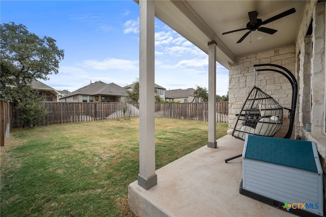 view of yard with a patio and ceiling fan