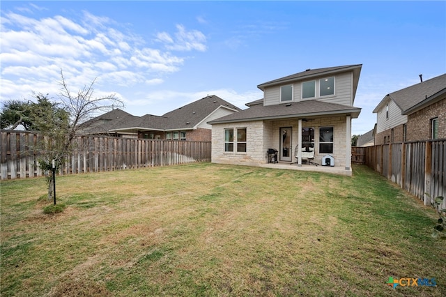 rear view of house with a patio area and a yard