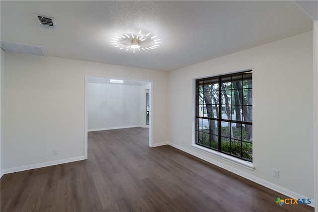 9215 Standing Creek Ln, San Antonio, TX 78230 - unfurnished room with dark wood-style flooring and baseboards