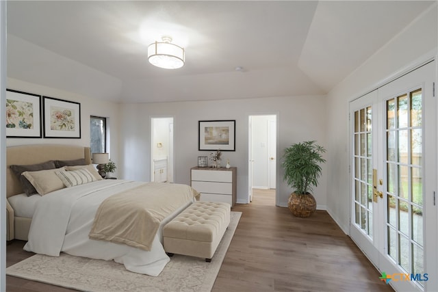 9215 Standing Creek Ln, San Antonio, TX 78230 - bedroom with french doors, wood finished floors, lofted ceiling, access to exterior, and ensuite bathroom