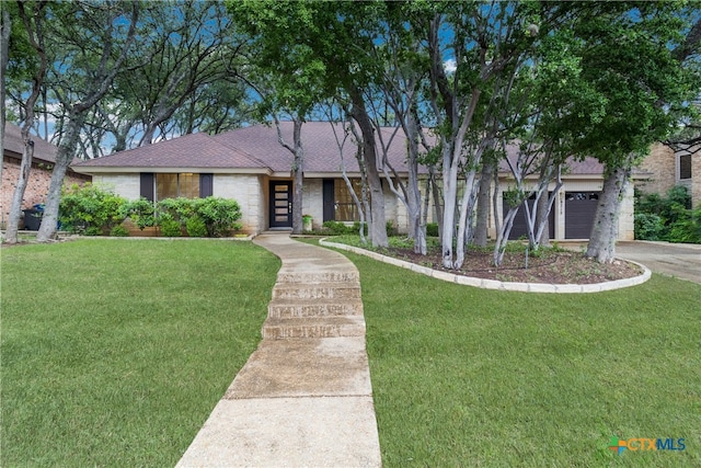 9215 Standing Creek Ln, San Antonio, TX 78230 - mid-century home with a front yard, a garage, and driveway