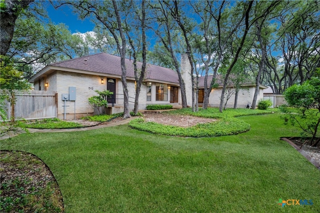 9215 Standing Creek Ln, San Antonio, TX 78230 - back of house featuring a chimney and brick siding