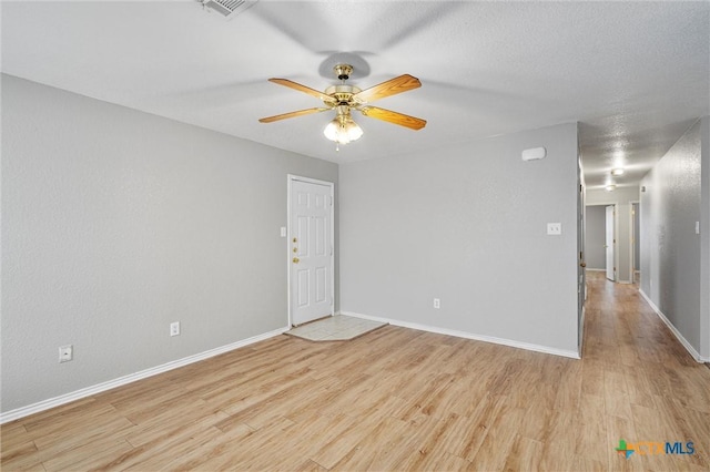 unfurnished room featuring light wood-type flooring and ceiling fan