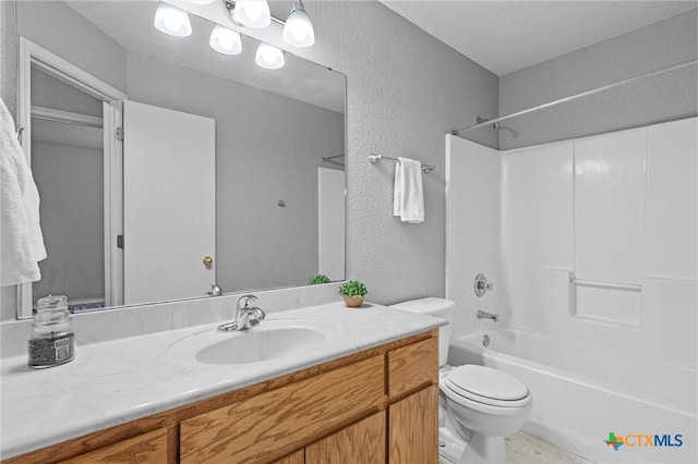 full bathroom featuring vanity,  shower combination, and toilet