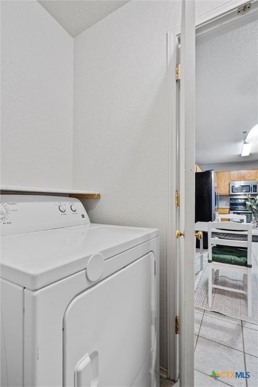 washroom featuring light tile patterned flooring