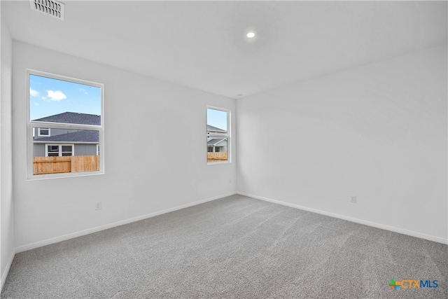 unfurnished room with carpet floors