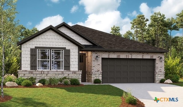 view of front of house featuring a front yard and a garage