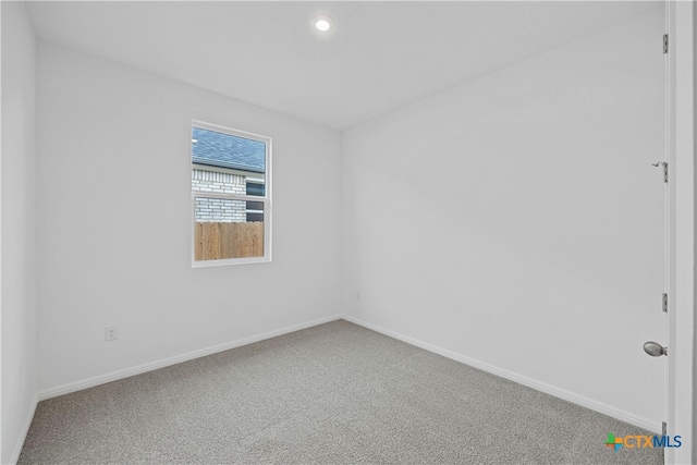 unfurnished room featuring carpet flooring