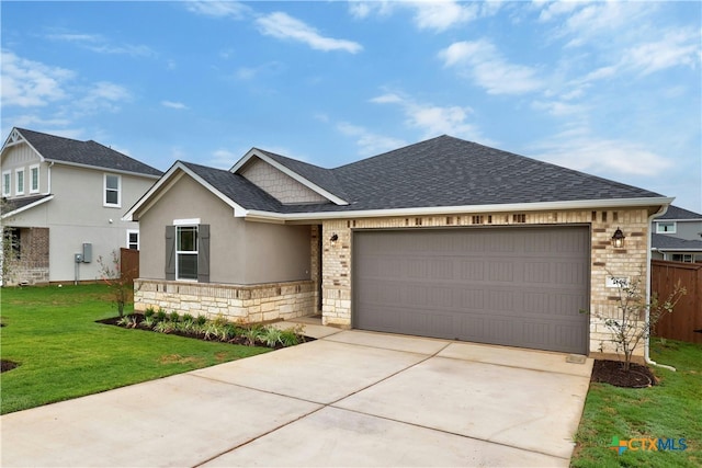 view of front facade with a garage and a front lawn