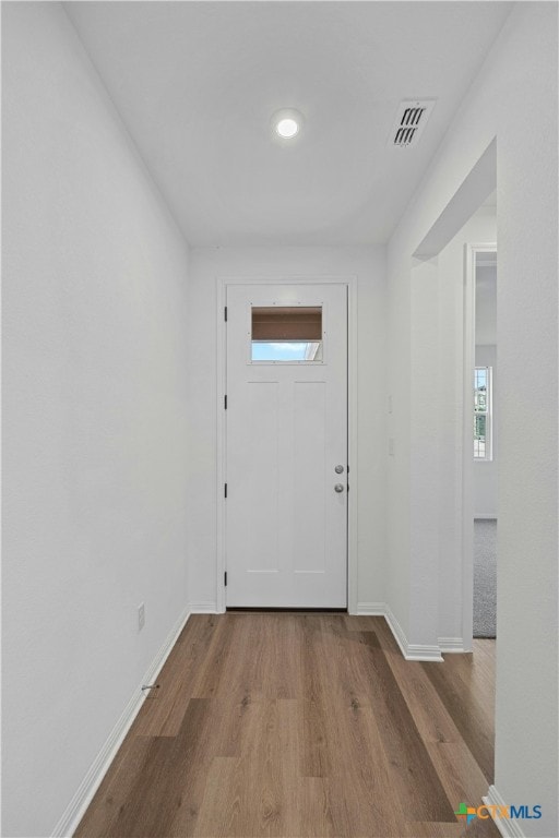 doorway with light hardwood / wood-style floors