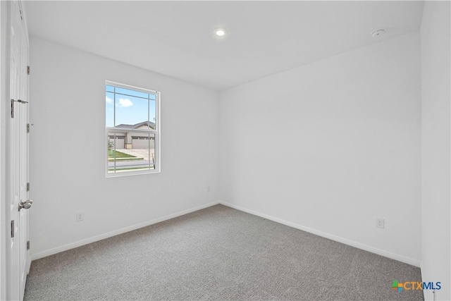 unfurnished room with carpet floors