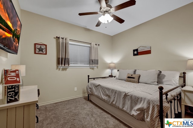 bedroom with ceiling fan and carpet flooring