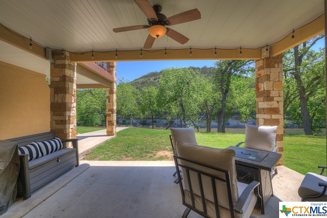 view of patio / terrace featuring ceiling fan