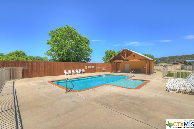 view of swimming pool featuring a patio