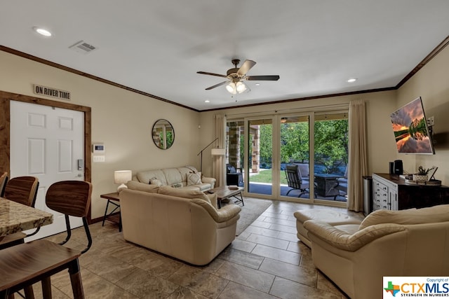 living room featuring ceiling fan and crown molding