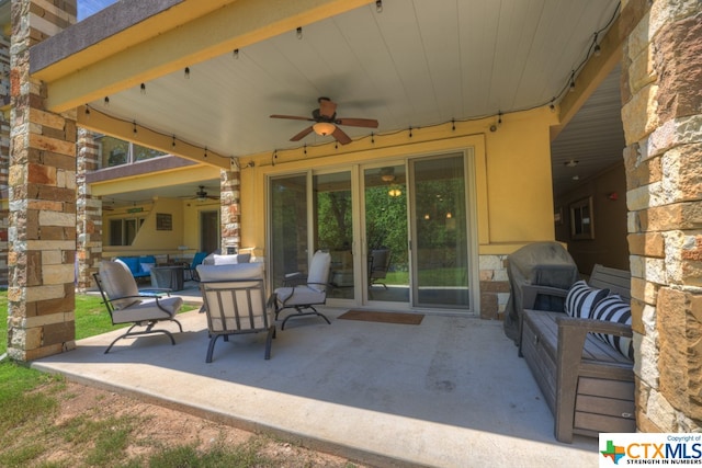 view of patio featuring ceiling fan and an outdoor living space