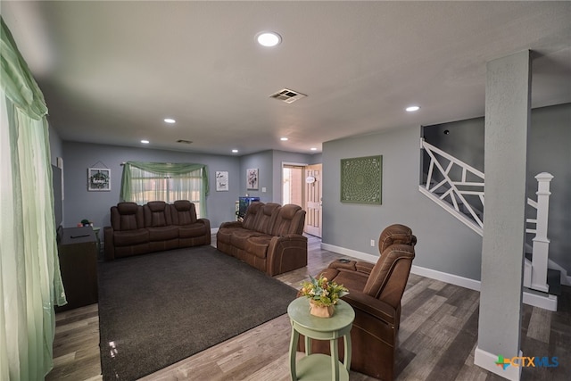 living room featuring dark wood-type flooring