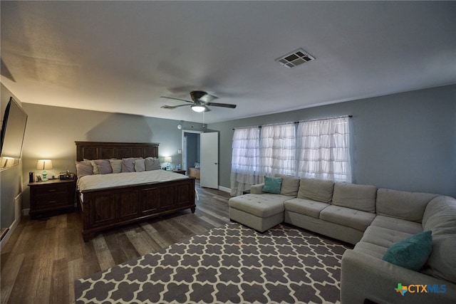 bedroom with dark wood-type flooring and ceiling fan