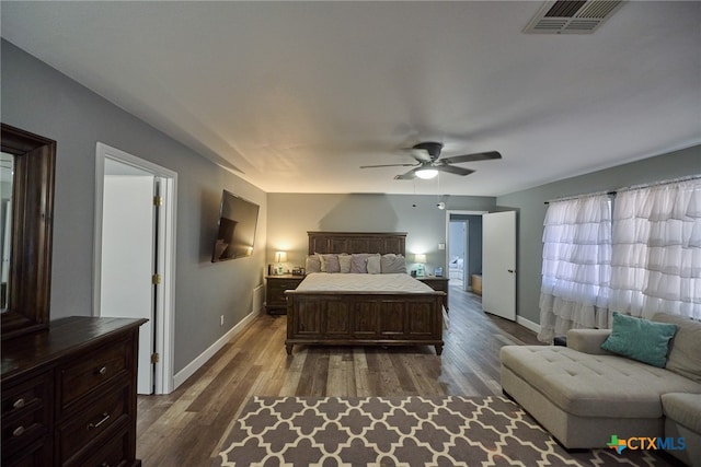 bedroom featuring dark hardwood / wood-style flooring and ceiling fan