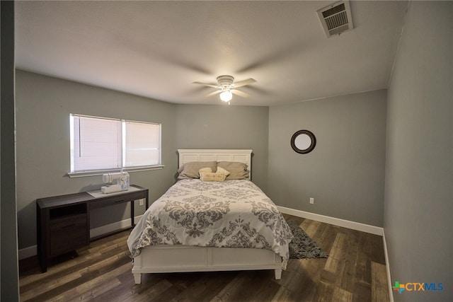 bedroom featuring ceiling fan and dark hardwood / wood-style flooring