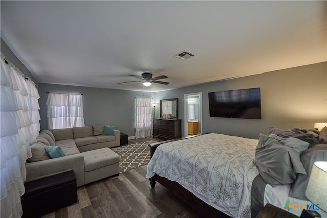 bedroom with multiple windows, ceiling fan, and dark hardwood / wood-style floors