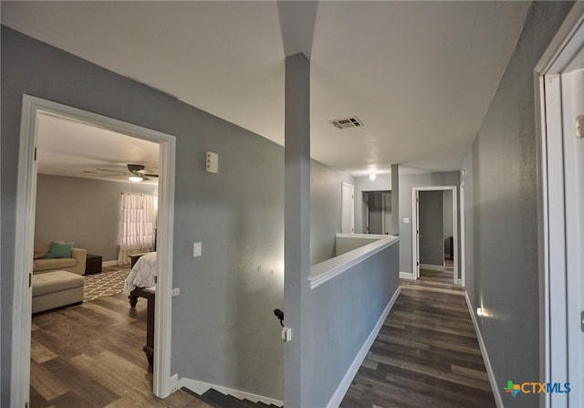 corridor featuring dark wood-type flooring