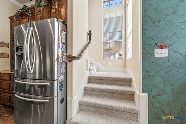 924 Queen Elizabeth Dr, Mcgregor, TX 76657 - staircase featuring plenty of natural light, an accent wall, and baseboards