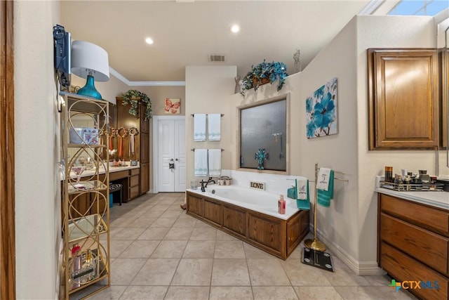 924 Queen Elizabeth Dr, Mcgregor, TX 76657 - bathroom featuring vanity, visible vents, tile patterned flooring, crown molding, and a garden tub
