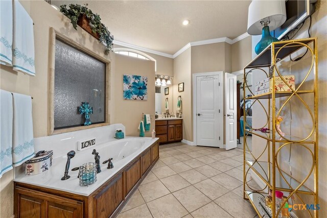 924 Queen Elizabeth Dr, Mcgregor, TX 76657 - bathroom featuring vanity, baseboards, a whirlpool tub, crown molding, and tile patterned floors