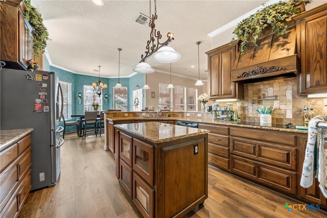 924 Queen Elizabeth Dr, Mcgregor, TX 76657 - kitchen featuring visible vents, ornamental molding, decorative backsplash, black appliances, and a sink