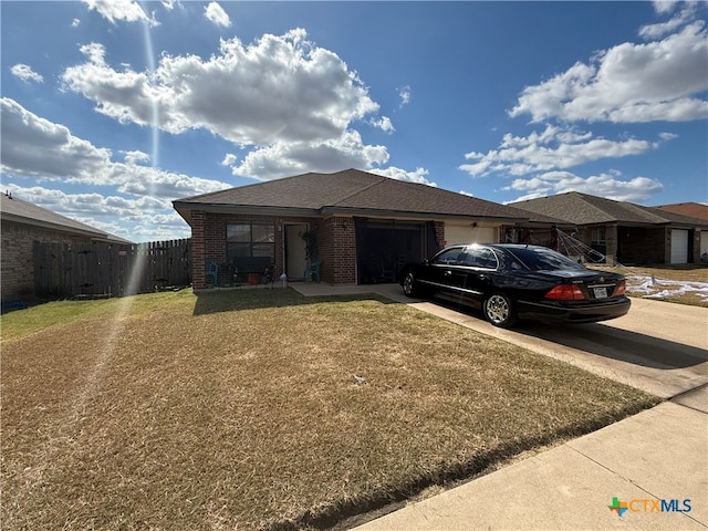 view of front of house with a garage and a front yard