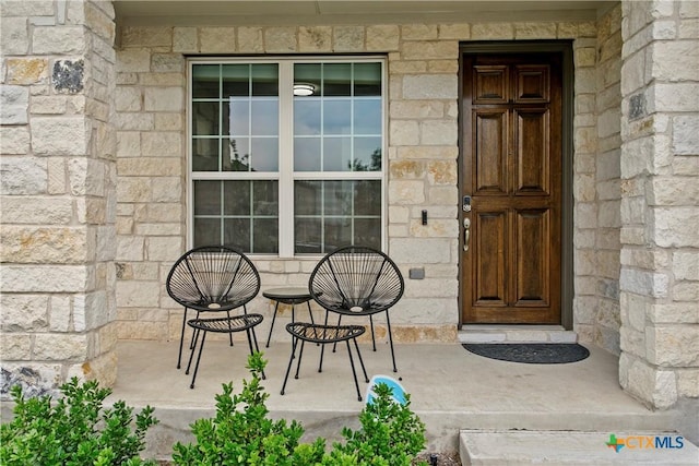355 Victoria Peak Loop, Dripping Springs, TX 78620 - view of exterior entry with stone siding