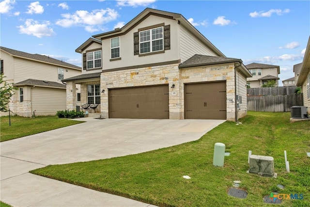 355 Victoria Peak Loop, Dripping Springs, TX 78620 - view of front of house with stone siding, cooling unit, concrete driveway, and an attached garage