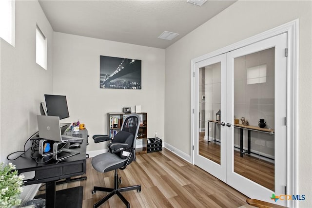 355 Victoria Peak Loop, Dripping Springs, TX 78620 - office area featuring french doors, wood finished floors, and baseboards