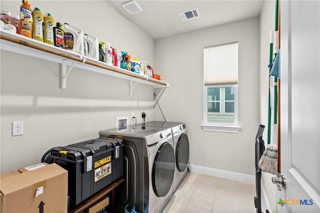 355 Victoria Peak Loop, Dripping Springs, TX 78620 - laundry area with washing machine and dryer, baseboards, and light tile patterned floors
