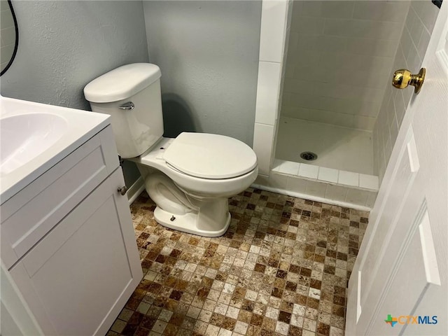 917 Edwards St, Copperas Cove, TX 76522 - bathroom with a stall shower, vanity, and a textured wall