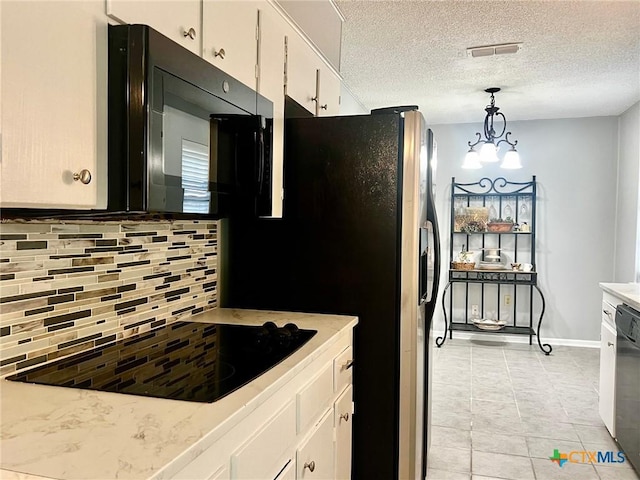 917 Edwards St, Copperas Cove, TX 76522 - kitchen featuring tasteful backsplash, black appliances, white cabinetry, light countertops, and light tile patterned flooring