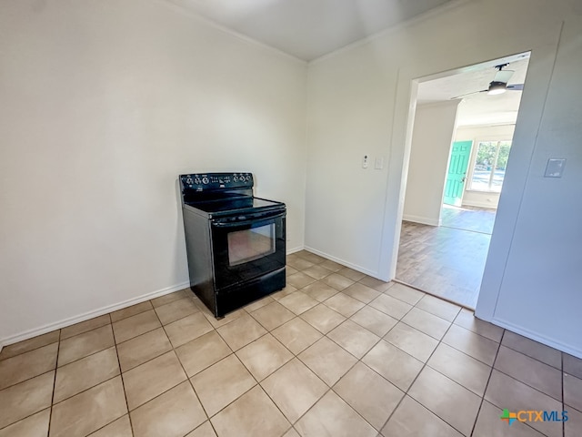 kitchen with black electric range, light tile patterned floors, ceiling fan, and crown molding