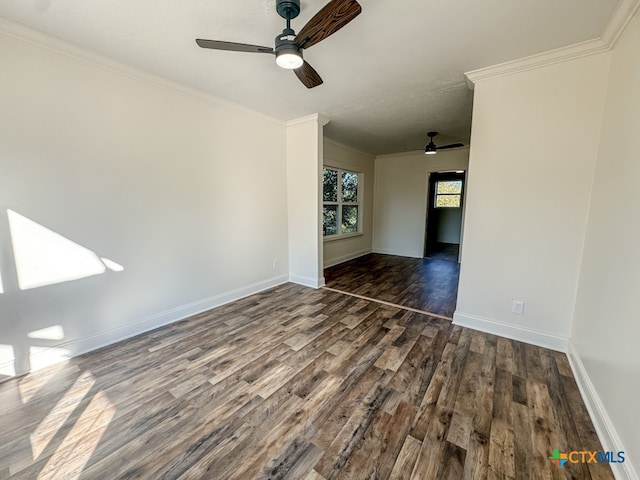 unfurnished room with crown molding and dark wood-type flooring