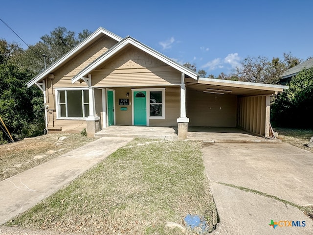 view of front of property with a carport