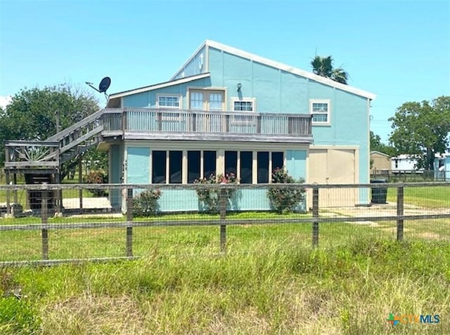 488 Alamo Beach Ave, Port Lavaca, TX 77979 - back of house with a balcony and stairway
